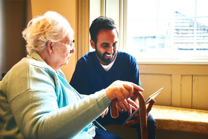 Older woman having an assessment with a care worker