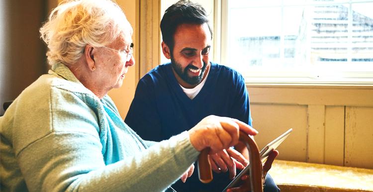 Older woman having an assessment with a care worker