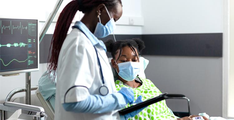 Black Woman hospital bed with doctor