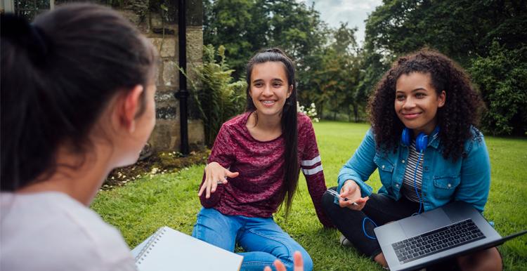 Teen girls discussion outdoors