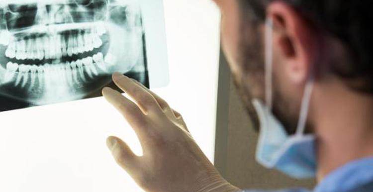 Image of dentist with xray