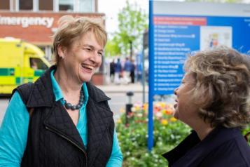 Two women outside a hospital