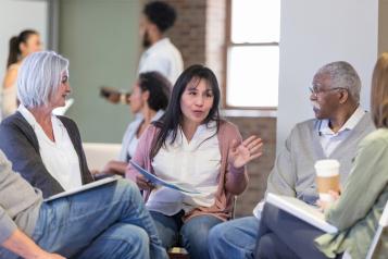 meeting with woman speaking in a small circle