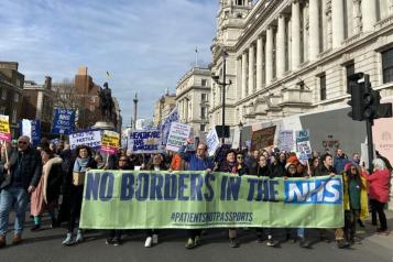 No borders in the NHS banner at demonstration