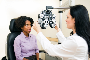 Young woman having her eyes tested