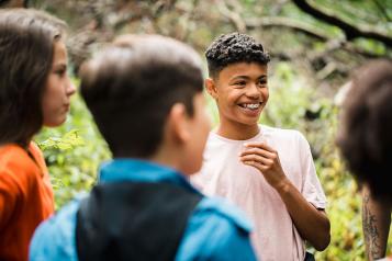 Early teen group talking to each other