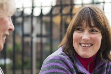 Women sitting down drinking coffee