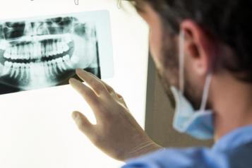 Image of dentist with xray