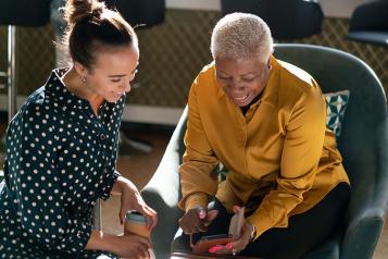 Women looking at smartphone