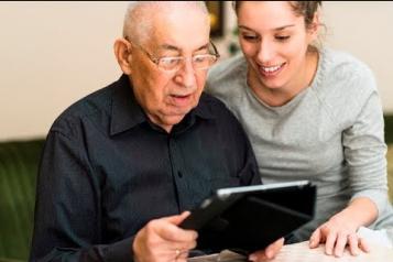 Man and woman looking at tablet