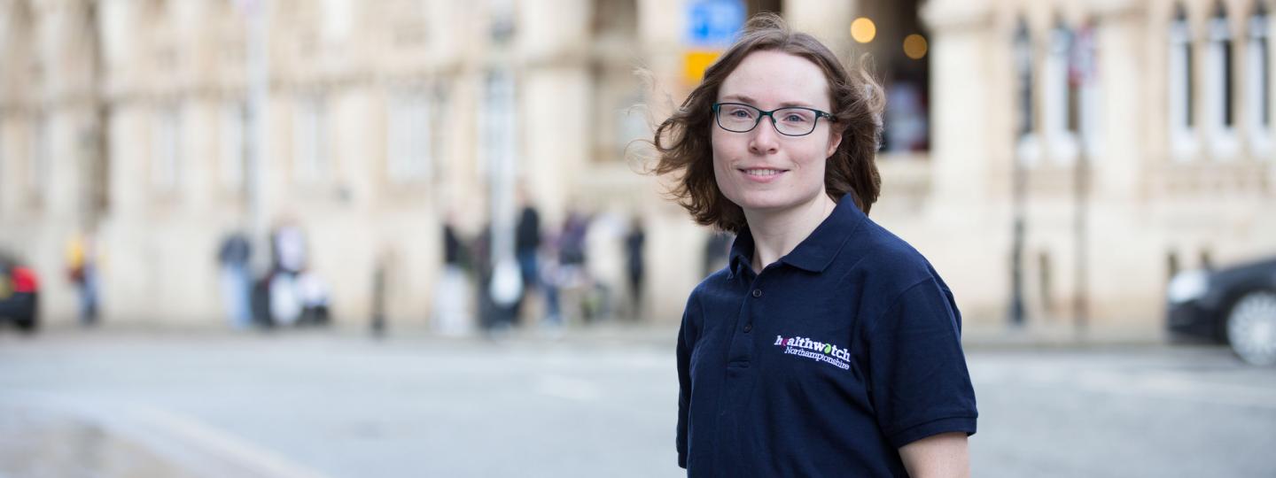 Healthwatch staff member standing outside