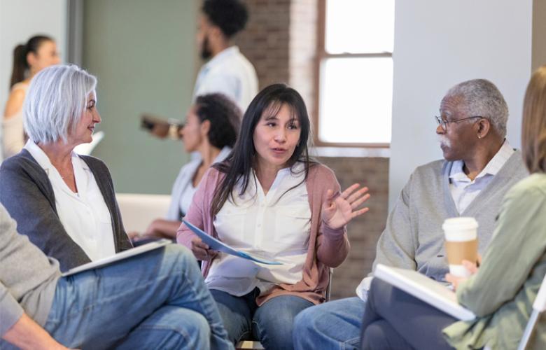 meeting with woman speaking in a small circle