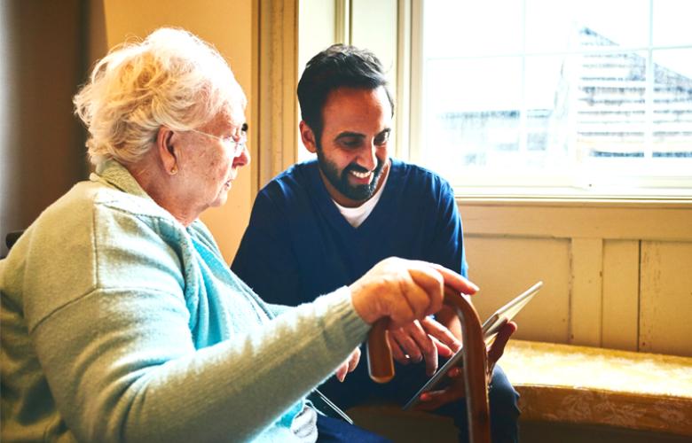 Older woman having an assessment with a care worker