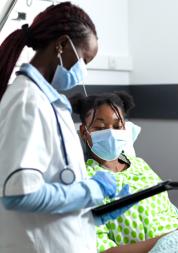 Black Woman hospital bed with doctor